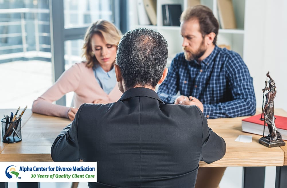 Divorce mediator meeting with couple to discuss settlement options and outline a comprehensive mediation timeline at Alpha Center for Divorce Mediation.