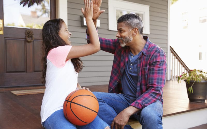 father and daughter on porch